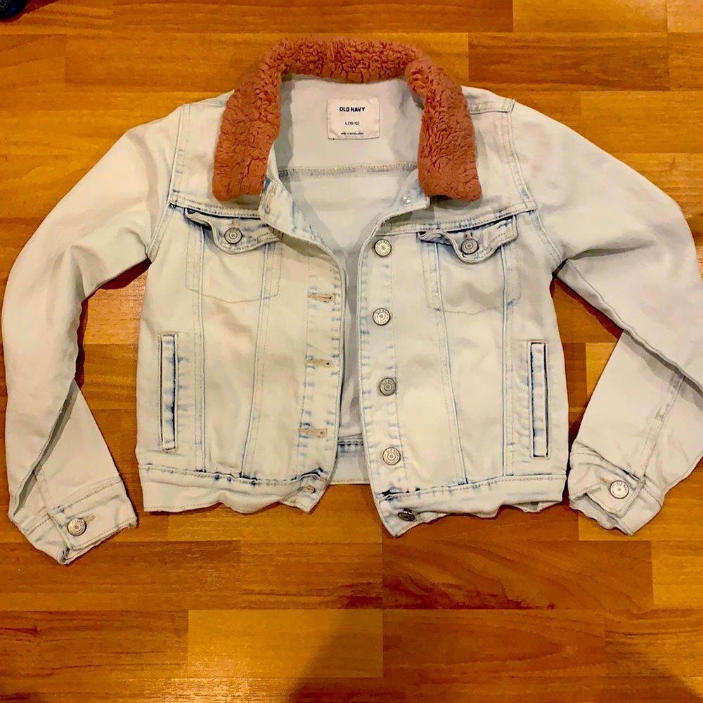 Jean jacket with pink fluffy collar.